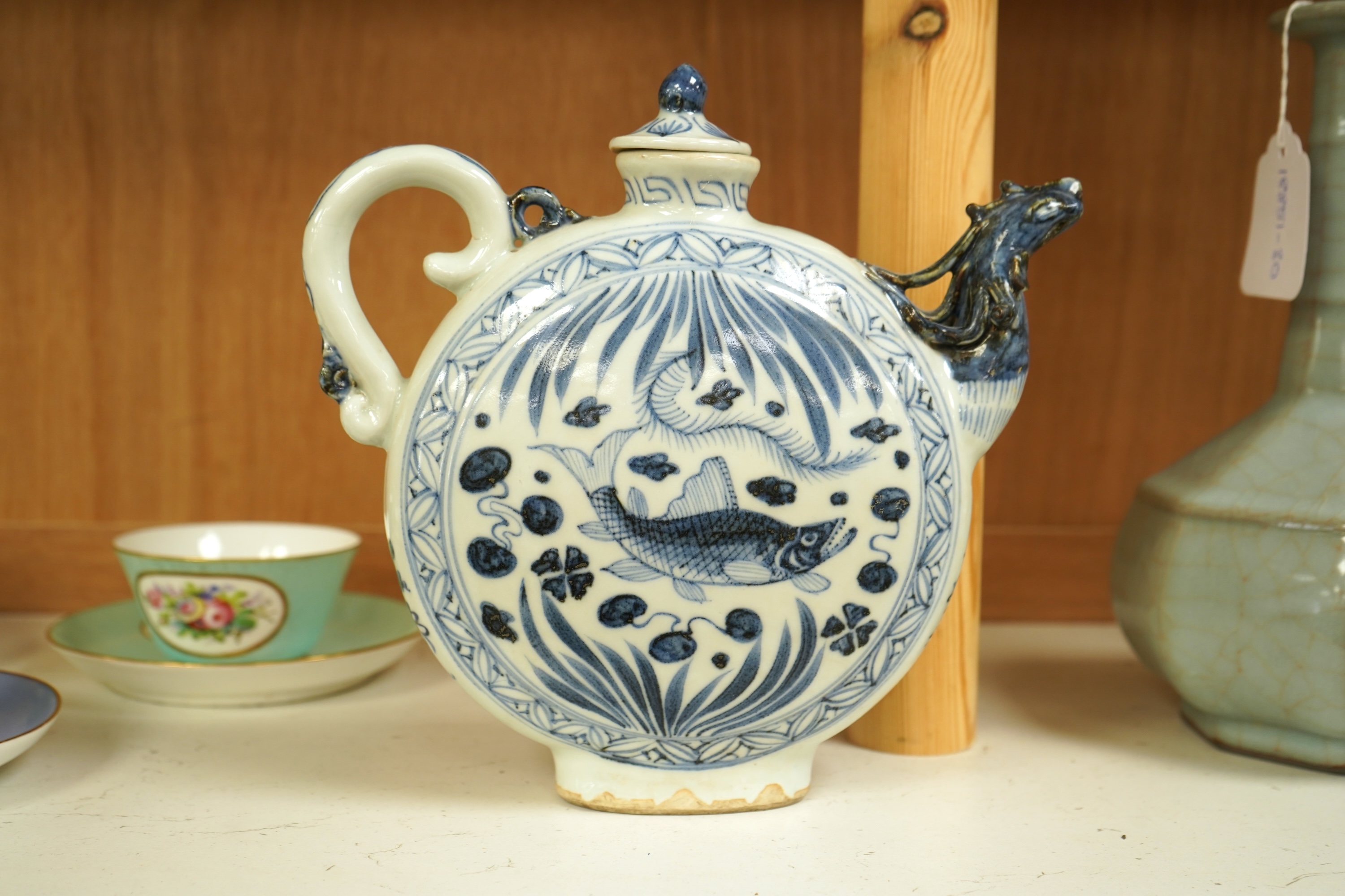 A Chinese blue and white moon flask wine pot with phoenix spout, 21cm high
